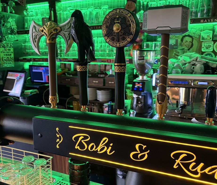Custom beer tap handles in a craft brewery bar